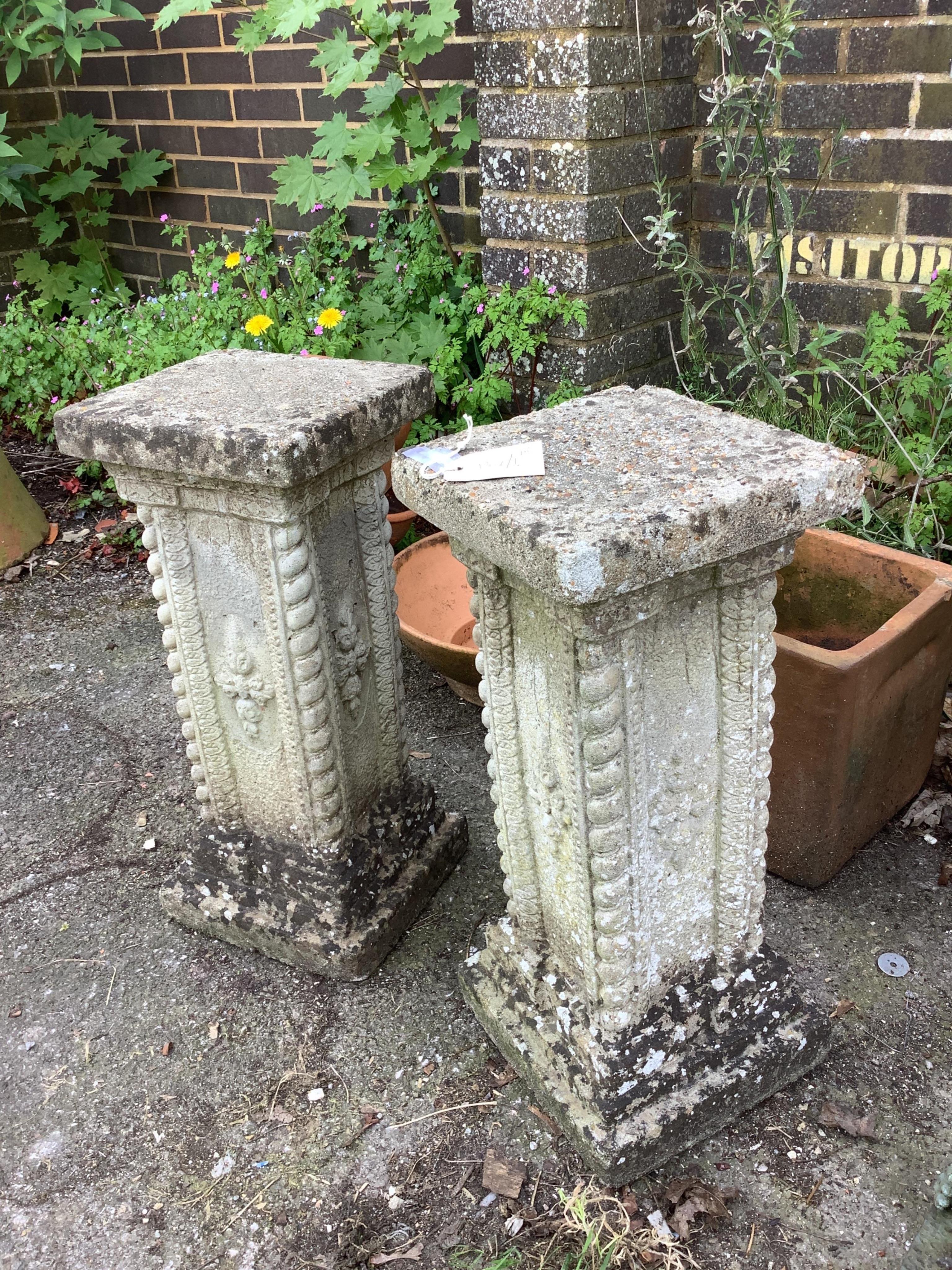 A pair of reconstituted stone garden pedestals, height 56cm